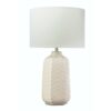 White ceramic table lamp with embossed chevron pattern and soft white linen tapered shade