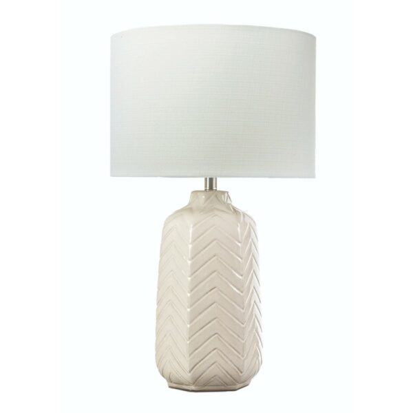 White ceramic table lamp with embossed chevron pattern and soft white linen tapered shade