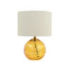 Beige linen drum shade table lamp with glass base