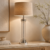 LLT Cheston Sand table lamp used on a living room sideboard with a warm elegant glow