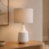 LLT Torquay Mini Natural table lamp styled on timber sideboard in warm contemporary living room interior