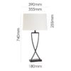 Modern sculptural crossed metal table lamp for contemporary homes
