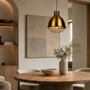LLP Nakia Antique Brass Pendant Light styled over dining table in modern industrial interior