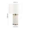 Modern terrazzo table lamp with gold accent and linen drum shade