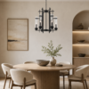 LLP Caviar 6LT Pendant Light installed over formal dining table in dark elegant interior setting