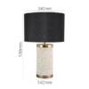Modern terrazzo table lamp with black shade and gold accents