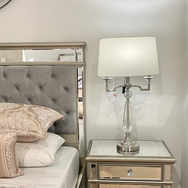 Tall crystal table lamp with white tapered oval shade