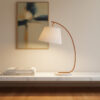 Curved timber table lamp with cement base