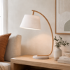 Curved timber table lamp with cement base