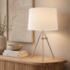 LLT Tripoli Nickel White table lamp styled on a bedside table in a modern interior