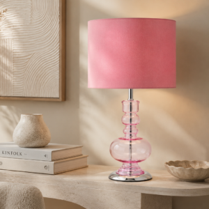 LLT Tulip Pink table lamp styled on a bedside table with soft romantic lighting