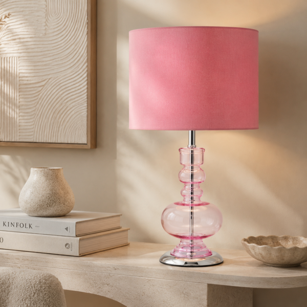 LLT Tulip Pink table lamp styled on a bedside table with soft romantic lighting