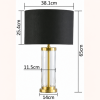 LLT Empire Black Table Lamp close up showing clear glass cylinder base and warm brass finish metal accent detail