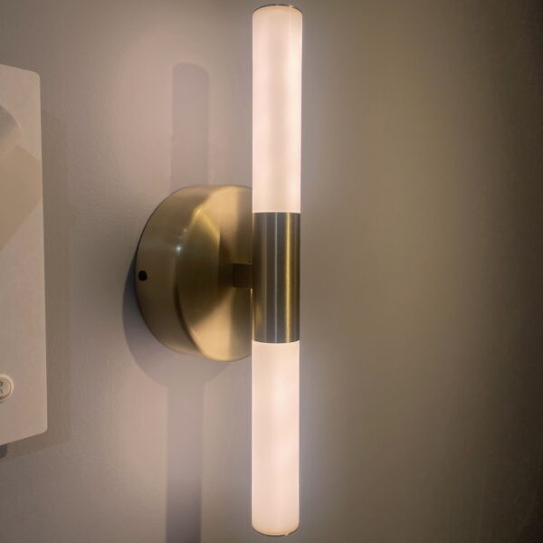 interior wall light with warm 3000K glow and brass finish