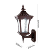 Classic heritage-style brass wall lantern with warm antique finish and clear glass