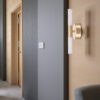 Modern brushed brass LED wall sconce for bathroom or hallway