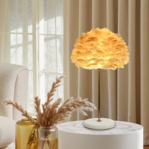Warm rose gold table lamp with soft natural feather light