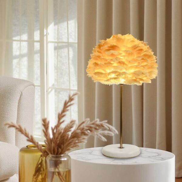 Warm rose gold table lamp with soft natural feather light
