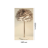 Elegant rose gold table lamp with soft grey feather light