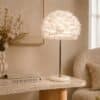 Elegant rose gold table lamp with soft white feather shade