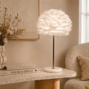 Elegant rose gold table lamp with soft white feather shade