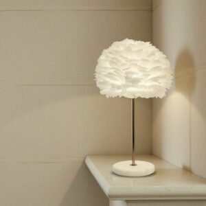 Elegant rose gold table lamp with soft white feather shade
