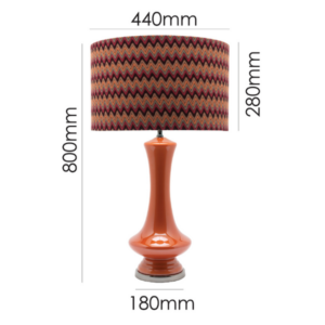 LLT Tanager Chevron Table Lamp styled as statement piece in contemporary living room interior with warm burnt orange tones