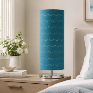 LLT Vardy Blue Table Lamp styled on bedside table in bright coastal bedroom interior with blue and neutral tones