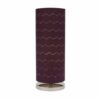 LLT Vardy Purple Table Lamp styled on bedside table in moody contemporary bedroom interior with rich purple accent tones