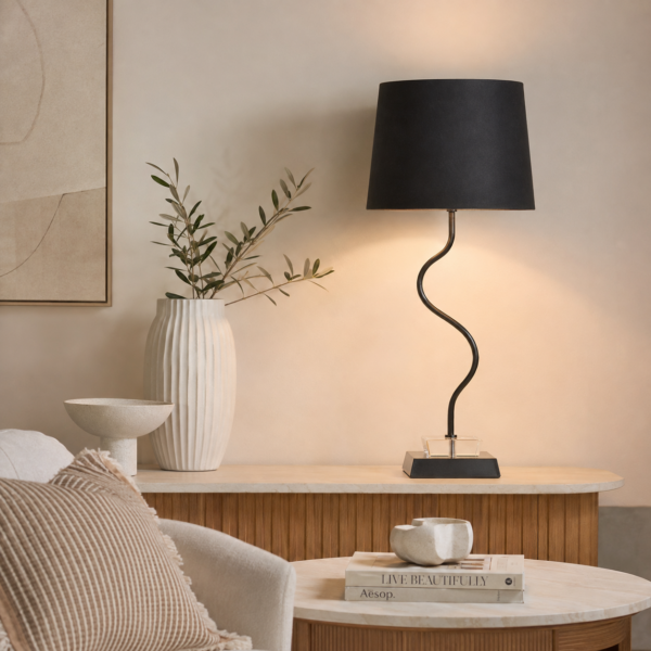 LLT Faiz Black Table Lamp styled on console table in glamorous contemporary interior with dark accent tones