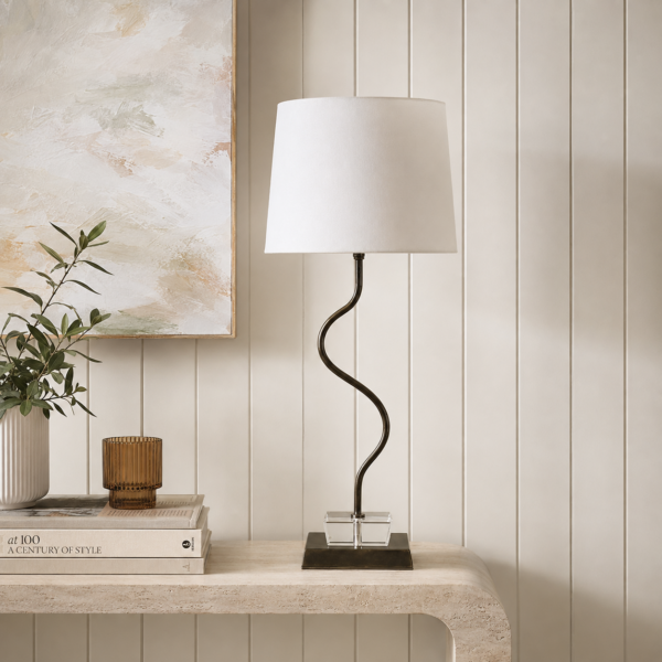 LLT Faiz White Table Lamp styled on bedside table in bright contemporary bedroom interior with white and neutral tones